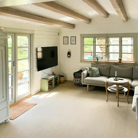 Black-painted Log House Overlooking Vejle Fjord Børkop