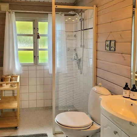 Black-painted Log House Overlooking Vejle Fjord * Børkop